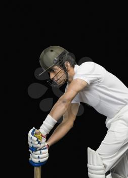 Cricket batsman in forward defensive stance