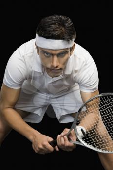 Tennis player practicing with a tennis racket