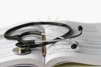 Close-up of a stethoscope on an open book
