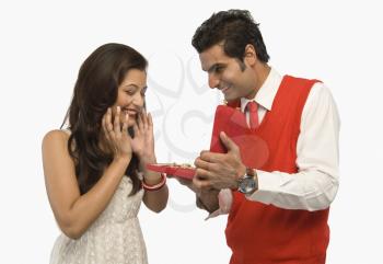Man giving a gift to his girlfriend