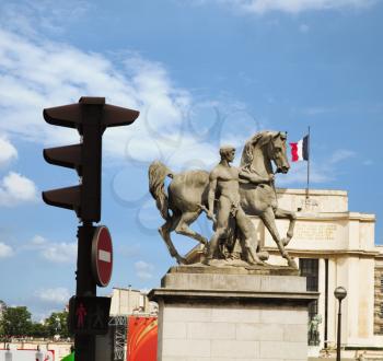 Low angle view of statues of a man with a horse, Paris, France