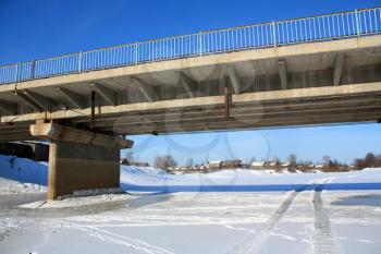 car bridge through frozen river