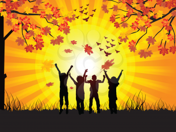 Royalty Free Clipart Image of Children in Silhouetted on an Autumn Landscape