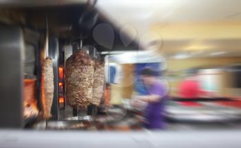 Turkish doner kebab in restaurant. Blur motion interior.