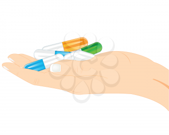 Capsules of the tablets on palm of the person on white background