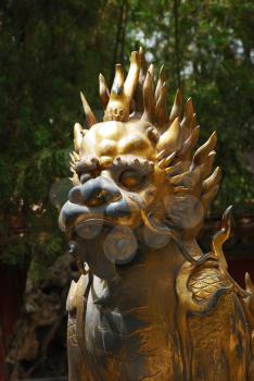 Bronze lion near the entrance to Emperor Garden in Forbidden City