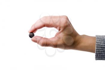 Royalty Free Photo of a Female Hand Holding a Pill