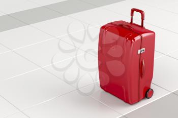 Red travel bag on tile floor 