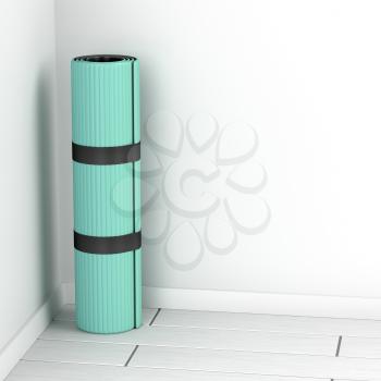 Rolled yoga mat in the room