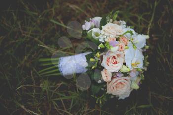 beautiful wedding flowers bouquet on the green grass