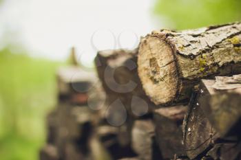 A stack of firewood close up with a large depth of field
