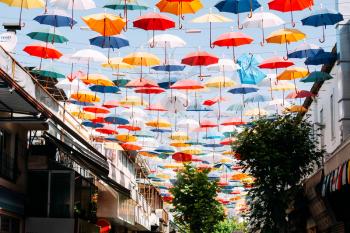 Umbrellas in the sky of Antalya, as a city tourist attraction. The symbol of the city, Kaleici