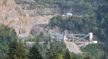 View of a quarry for stone mining in the European mountains. Industrial landscape