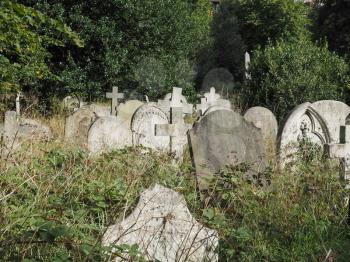 Graves and crosses and stones at old gothic cemetery in London, UK