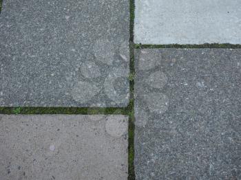 Grey concrete pavement tiles useful as a background