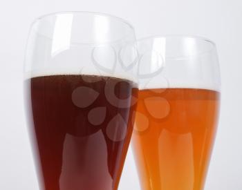 Two glasses of German dark and white weizen beer