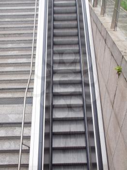 Escalator stairs to an underground station or supermarket
