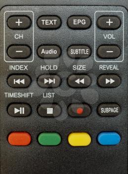 detail of digital terrestrial tv remote control with channel, volume and recording keys