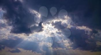 Gods light. Rays of light through dark clouds. sun shines from cloud
