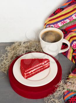 Red tasty cake slice with black coffee