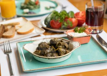 Tasty meat meal, dolma with vegetables on the table