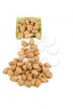 Royalty Free Clipart Image of Almonds in a Green Cup