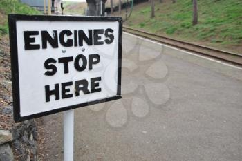 Royalty Free Photo of an Engine Stops Here Sign