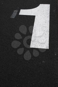 Royalty Free Photo of a Number Sign Painted on the Asphalt Road