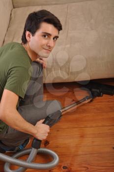 Royalty Free Photo of a Young Man Cleaning