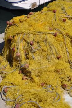 Royalty Free Photo of a Yellow Fishing Net on Kalymnos Island, Greece