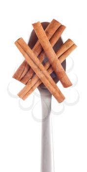 Royalty Free Photo of a Spoonful of Cinnamon Sticks