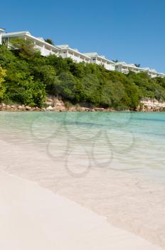 Royalty Free Clipart Image of a Beach in Long Bay, Antigua