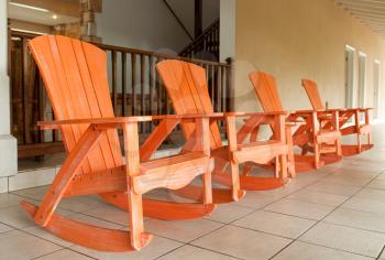 Royalty Free Photo of a Row of Rocking Chairs