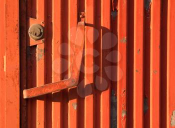 Royalty Free Photo of an Orange Rusty Iron Door as a Background
