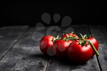 stock photo of tomatoes on a stem background