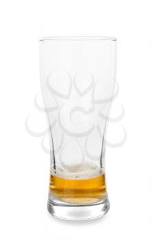 Almost empty glass of cold beer on white background�
