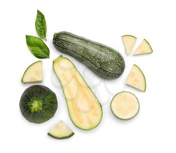 Top view composition with sliced zucchini on white background�