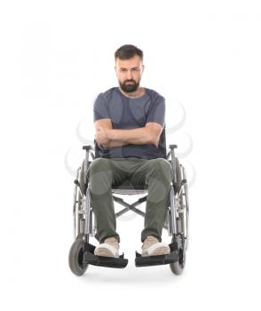 Angry man in wheelchair on white background�