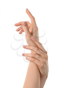 Female hands with nude manicure on white background�