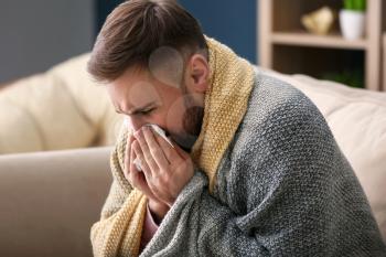 Young man ill with flu at home�