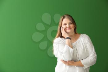 Beautiful plus size girl on color background. Concept of body positivity 