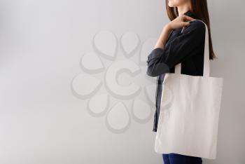 Woman with blank bag for branding on white background�