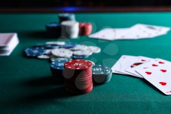 Chips and cards on table in casino�