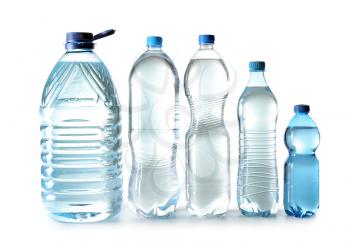 Different bottles of clean water on white background�