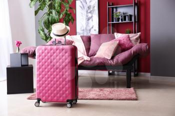 Packed suitcase in room. Travel concept�