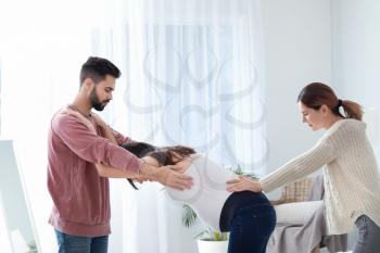 Pregnant couple with doula at home�