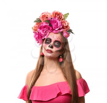 Young woman with painted skull on her face for Mexico's Day of the Dead against white background�