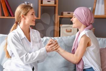 Doctor telling good news to woman after chemotherapy�