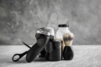 Set of male shaving accessories on table�