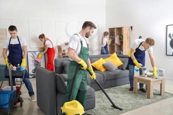 Team of janitors cleaning room�
